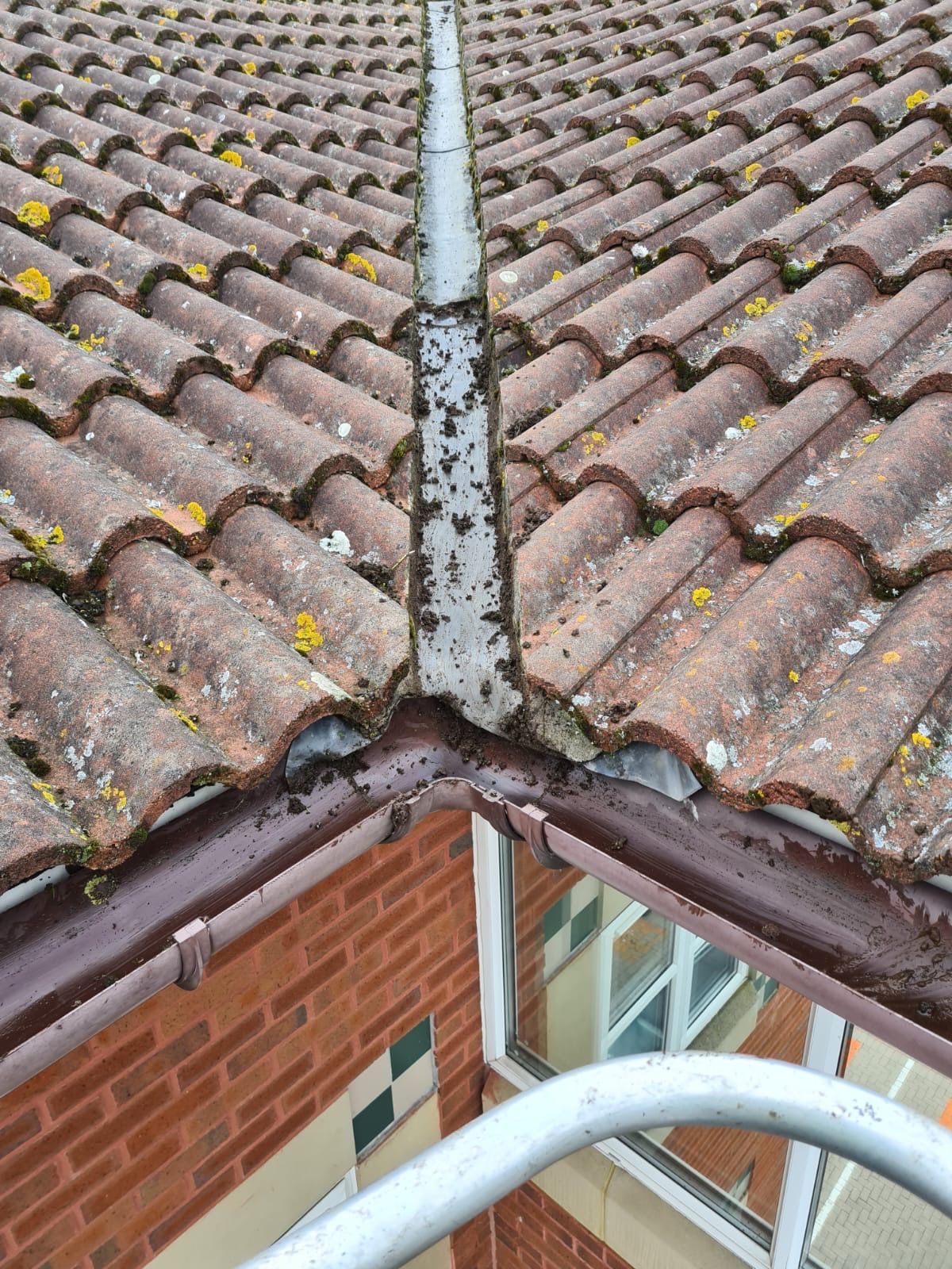 After: tiled roof corner gutter fully cleared